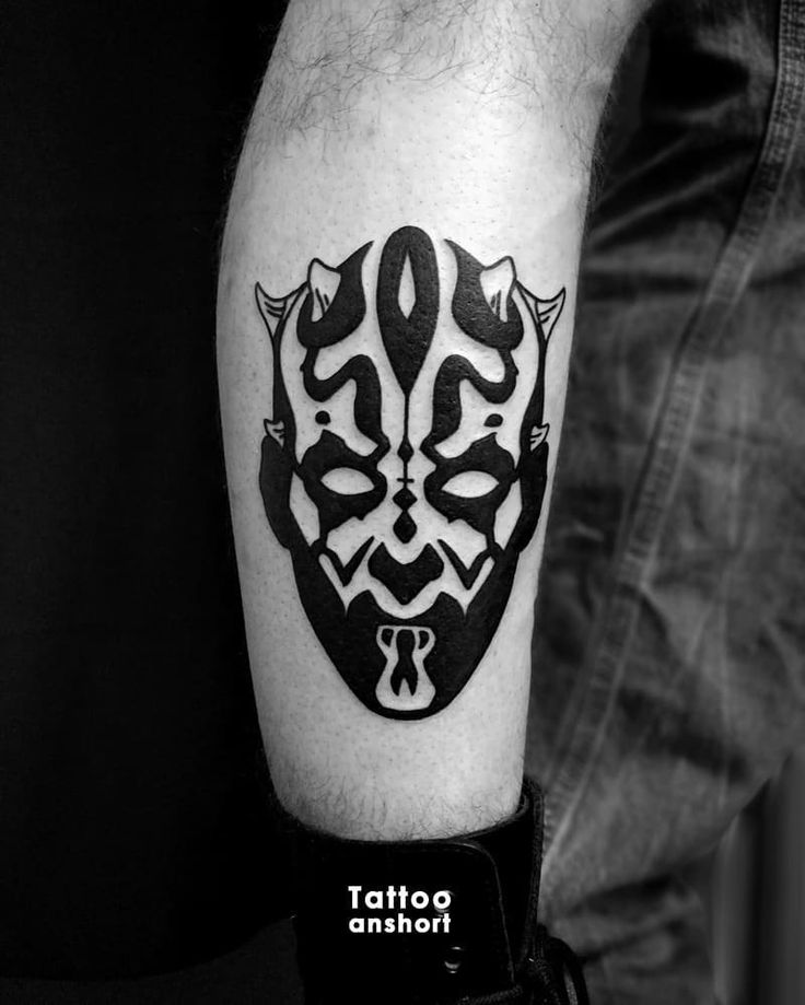 a black and white photo of a tattoo design on the arm with an image of darth vader