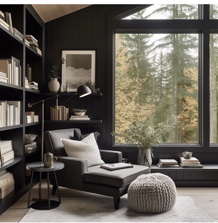 a living room filled with lots of books and furniture next to a large open window