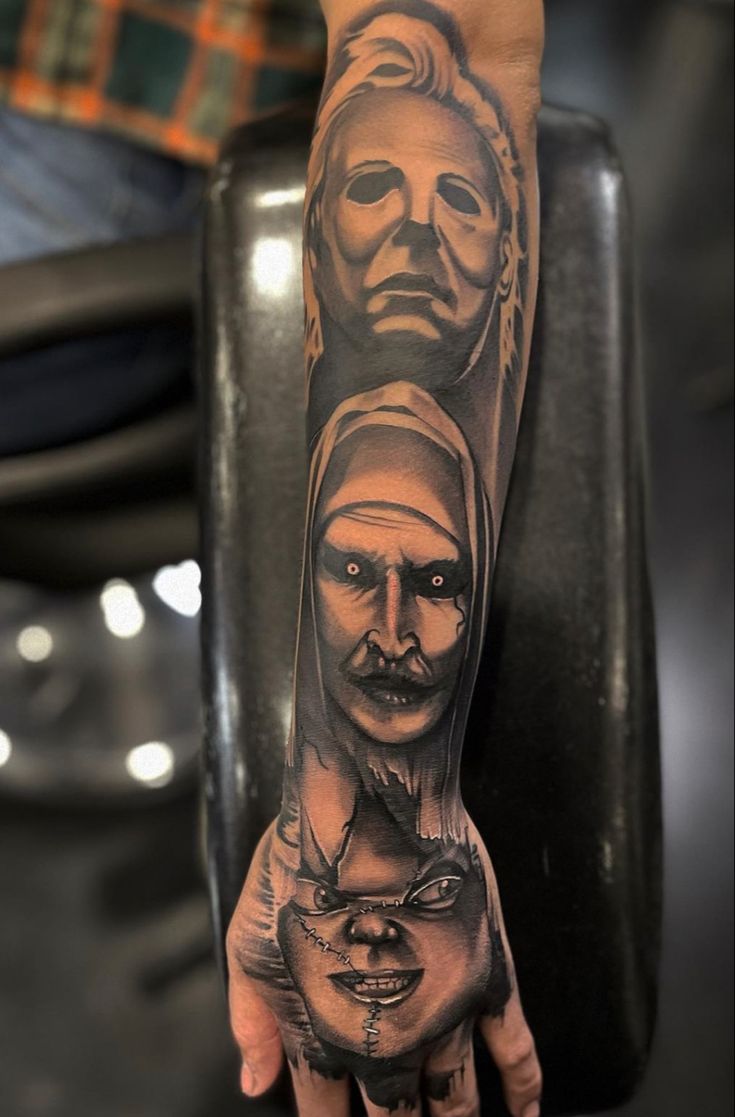 a man's arm with tattoos on it and an image of two people in the middle