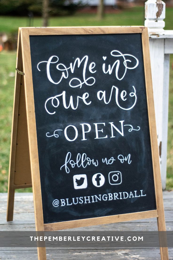 a chalkboard sign that says come in we are open follow us on bleashngbirdsall