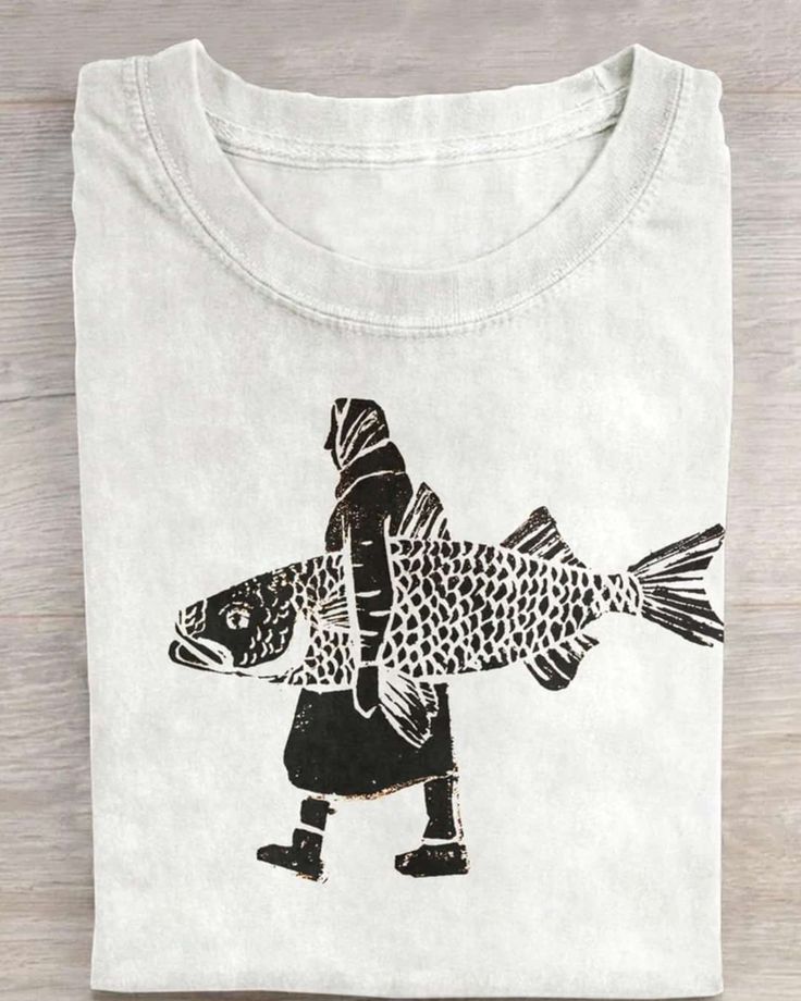 a t - shirt with a drawing of a man carrying a fish on his back