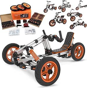 an orange and black toy car with wheels, tires and parts on it's side