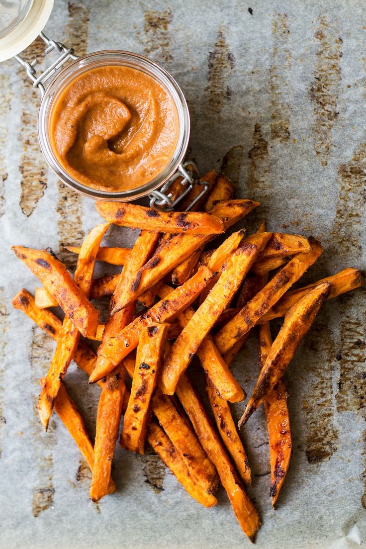 sweet potato fries with dipping sauce on the side