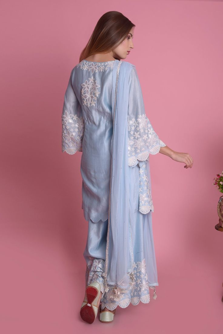 Powder blue straight kurta with all-over floral motif applique-dori work and scallop hem. Comes with sharara pants and tassel dupatta.
Component: 3
Embroidered
Neckine: Round
Sleeve Length: Three Quarter
Fabric: Kurta and Pant: Silk Chanderi; Dupatta: Chiffon
Color: Blue
Side slits
Tassel dupatta
Flared sleeves
Keyhole neck - Aza Fashions Chiffon Sharara, Tassel Dupatta, Dori Work, Sharara Pants, Kurta Sharara Set, Chanderi Dupatta, Kurta Sharara, Blue Kurta, Keyhole Neck