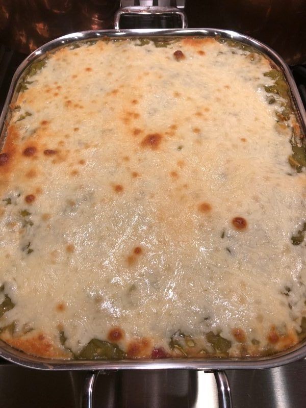 a casserole dish sitting on top of a stove