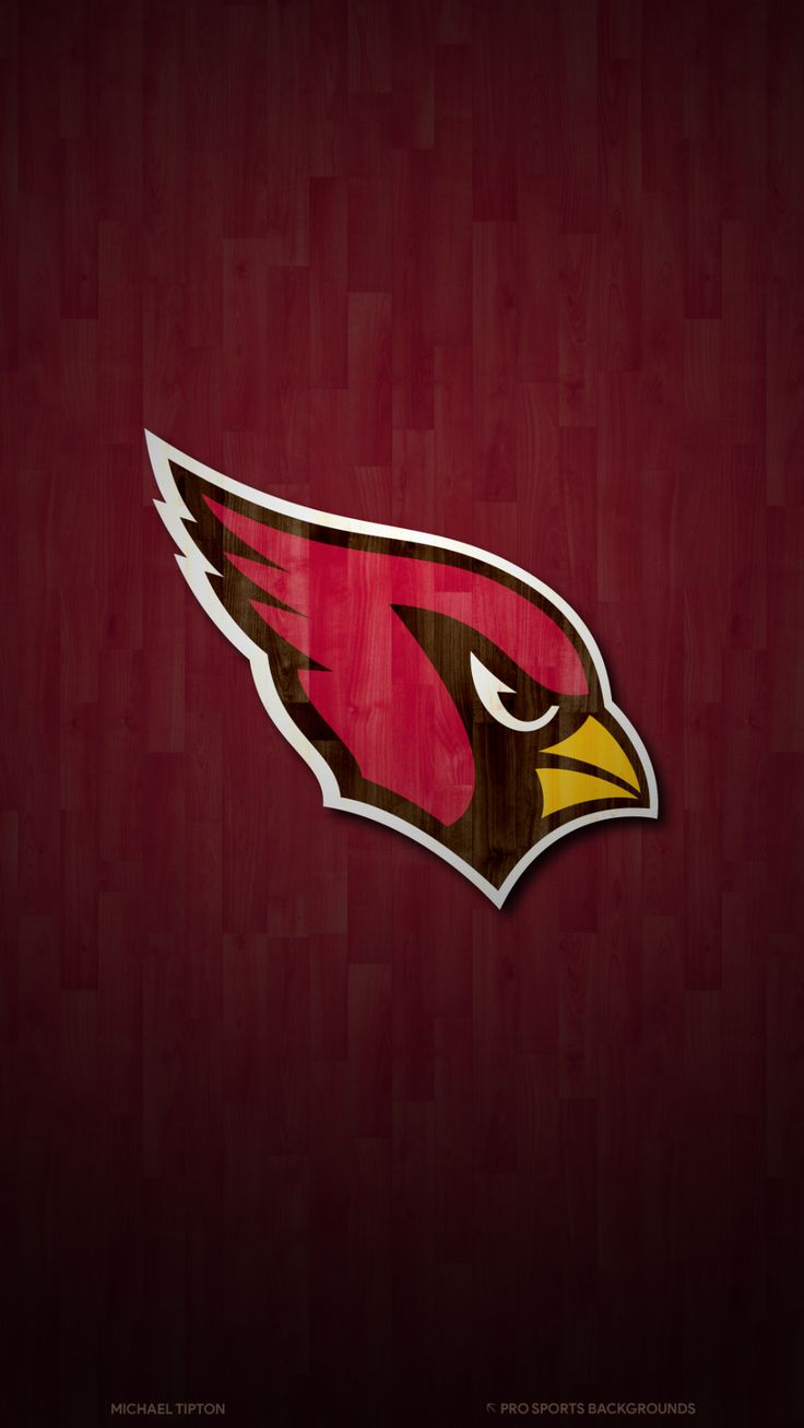 the arizona cardinals logo on a wooden background