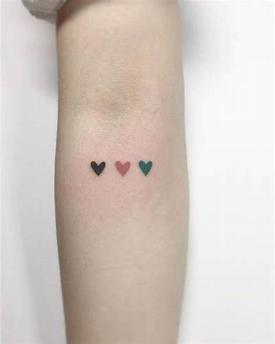 three hearts tattoo on the arm