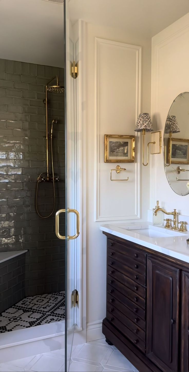 a bathroom with a walk in shower next to a sink