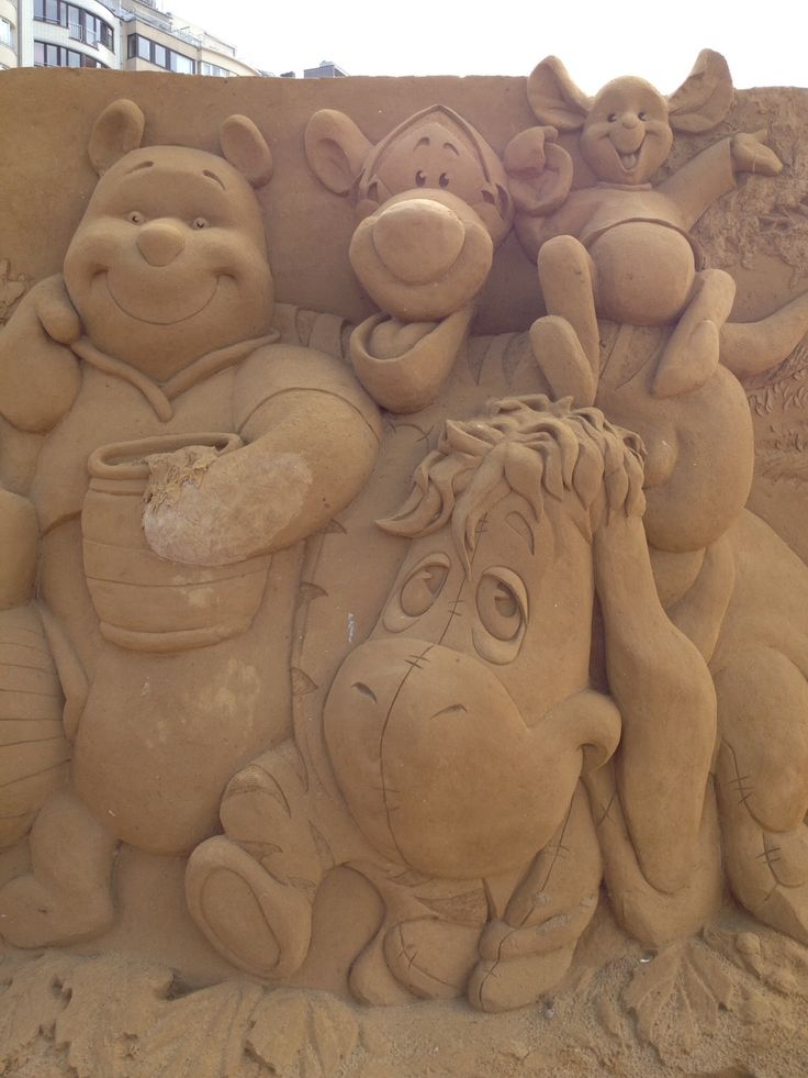 a sand sculpture of winnie the pooh and friends