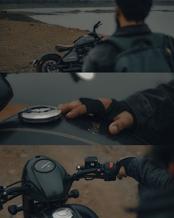 a man sitting on top of a motorcycle next to a river and holding onto the handlebars