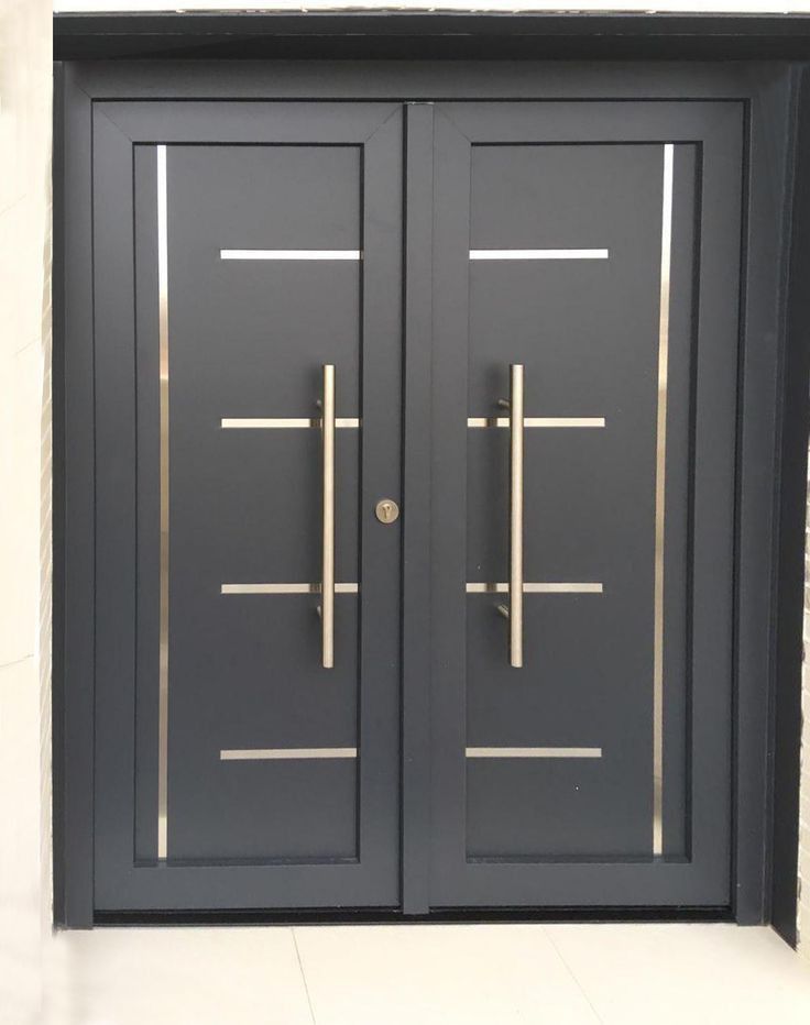 two black double doors with gold bars on them