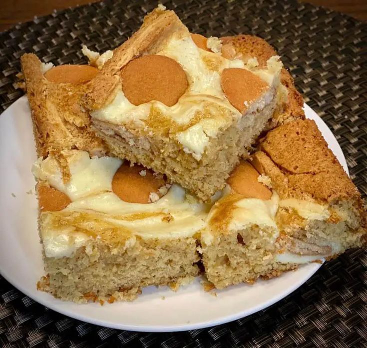 four pieces of cake on a white plate