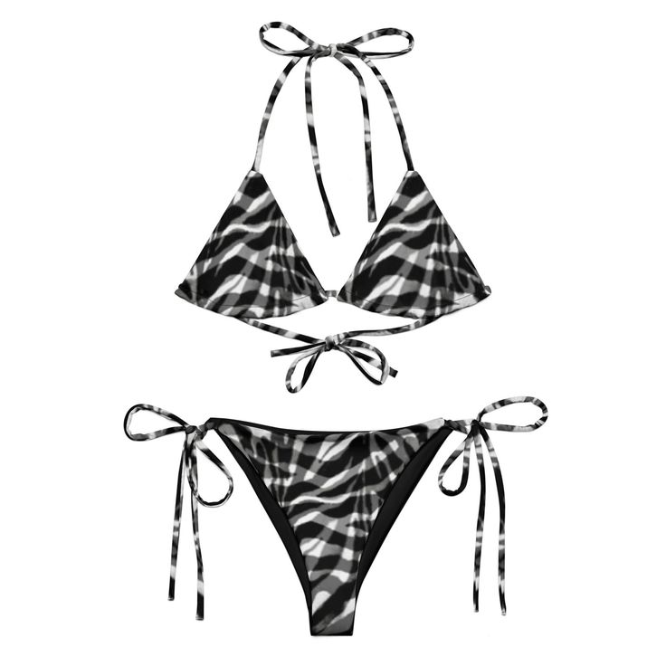 Stay comfortable and stylish all summer with this All-Over Print Recycled String Bikini set. It's made from soft recycled polyester with double-layering and UPF 50+. Style the straps how you like and get ready to swim!  * Soft and stretchy material with UPF 50+ * Sizes up to 6XL * Bikini top comes with removable padding for comfort * Multiple ways to tie and style the bikini set Disclaimer: To make your All-Over Print Recycled String Bikini last longer, thoroughly rinse it off after each use and get rid of any chlorine/salt residue. Adjustable Beachwear Swimwear For Vacation, Adjustable Beachwear Tankini For Vacation, Black Printed Beachy Swimwear, Black Tie-side Bottom Swimwear For Beach, Black Tie-side Swimwear For Beach, Printed Tie-side Bottom Swimwear, Black Swimwear For Festival And Vacation, Black Printed Swimwear For The Beach, Black Tankini For Vacation