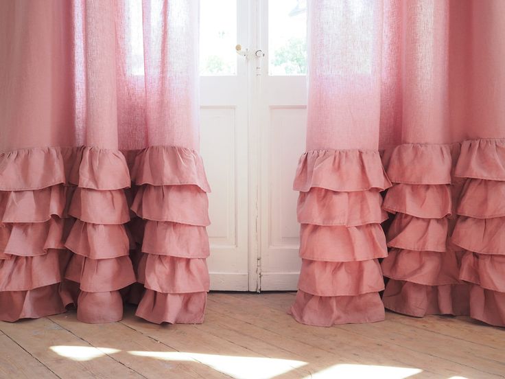 pink curtains with tiered ruffles in front of a white door