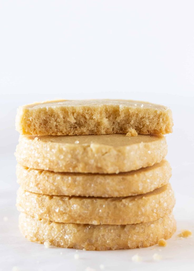 a stack of shortbread cookies on top of each other with peanut butter in the middle