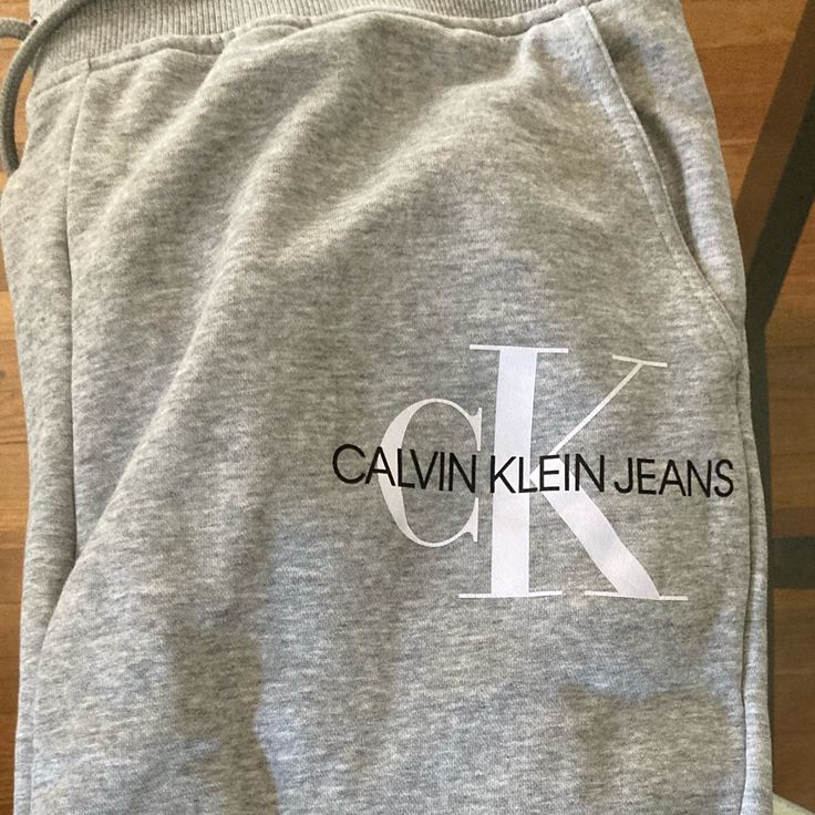 Calvin Klein Monogram Sweatpants. Bought Large By Mistake. Am A Medium. Never Worn. Smoke Free Home. Logo Print Cotton Pants For Loungewear, Cotton Logo Print Loungewear Pants, Cotton Loungewear Pants With Logo Print, Calvin Klein Cotton Bottoms With Elastic Waistband, Relaxed Fit Cotton Bottoms With Logo Print, Casual Pants With Logo Print For Loungewear, Casual Calvin Klein Relaxed Fit Pants, Casual Stretch Bottoms With Logo Print, Calvin Klein Relaxed Fit Bottoms With Pockets