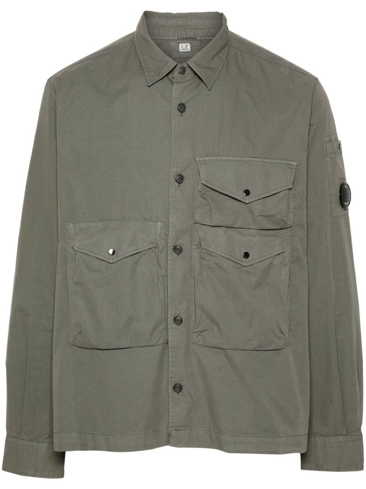 olive green cotton gabardine weave classic collar long sleeves signature Lens detail buttoned-cuff sleeves three front flap pockets straight hem front button fastening C.P. Company suggests removing any detachable accessories before washing. Comme Des Garcons Converse, Buttoned Shirt, City Shorts, Jumpsuit Jacket, C P Company, Airport Fashion, Balenciaga Triple S, Stella Mccartney Adidas, Summer Beach Wear