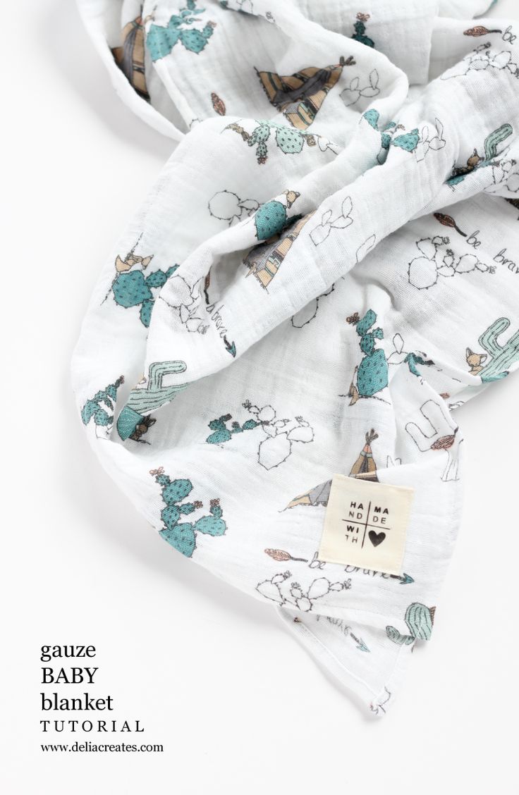 a white scarf with blue animals on it