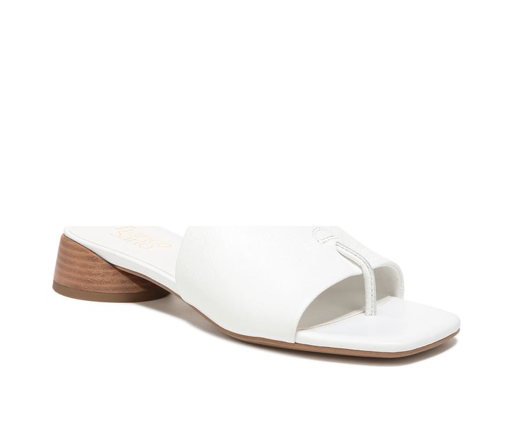 Shaped to perfection. This slide’s modern, artistic lines elevate every look. Leather upper. Eco-conscious linings with soft + sustainable comfort. Slip-on fit. Open square toe with hidden thong post. Extra padding for added comfort. 1.18 inch sculpted oval block heel. Leather upper, Easy slip-on entry, Approx. 1 1/4 inch heel, Open toe, Eco-conscious lining with padded footbed, Durable synthetic outsole, Franco Sarto® branding details | Women's Franco Sarto Loran Dress Sandals in White Size 5 Sandals White, White Slip, Shoe Carnival, 4 Inch Heels, Franco Sarto, Dress Sandals, Eco Conscious, Low Heels, Women's Pumps