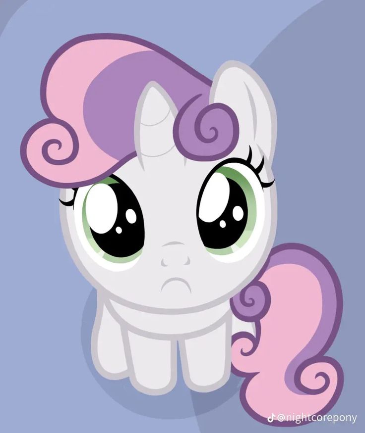 a little pony with big eyes and pink hair