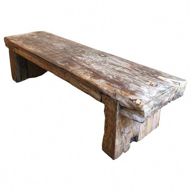 an old wooden bench is shown against a white background