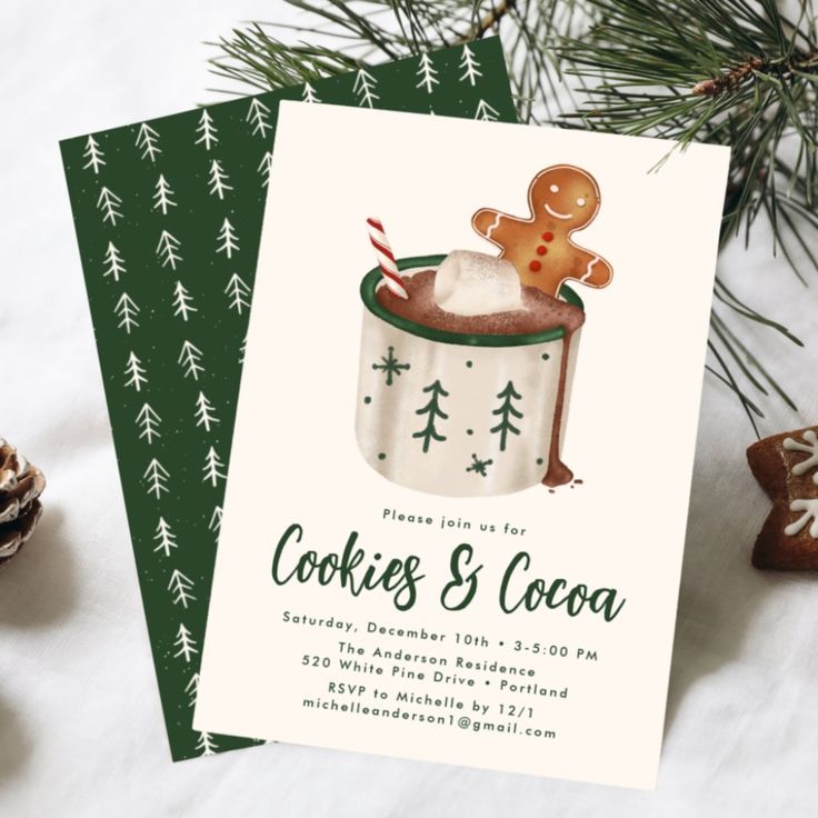 some cookies and cocoa in a cup on top of a table next to pine cones