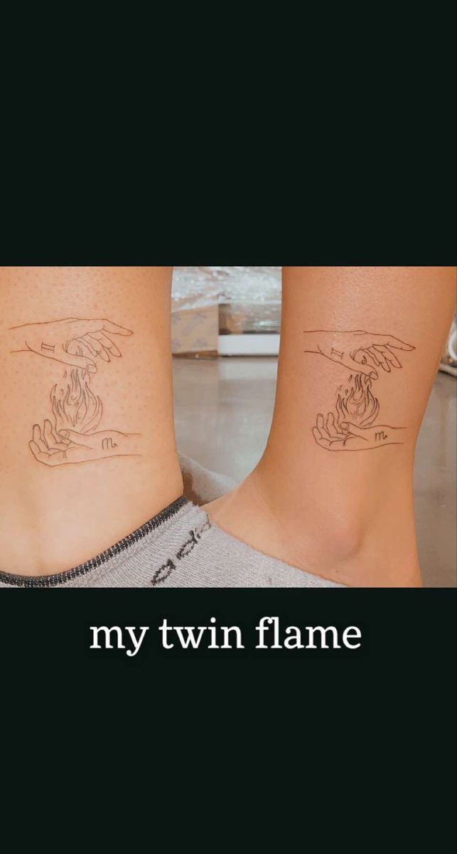 two people with tattoos on their legs and the words, my twin flame written in black ink