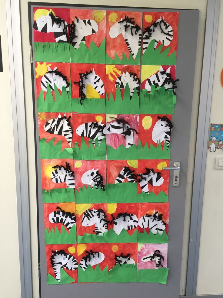 a classroom door decorated with zebras and sunbursts on green paper towels