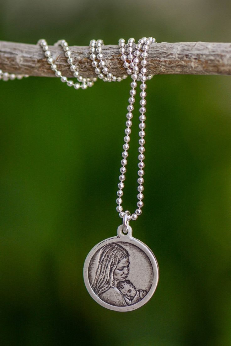 "This delicate photo charm features your favorite picture carved in fine silver. Each photo charm we make is delicately carved from scratch. Each engraving is stunningly detailed resulting in a magnificent and treasured keepsake. Each engraved picture is coated during finishing process with a protective shield. If you like to personalized with special message on the back of the pendant / charm. You can purchase \"personalized engraving via the link below: https://www.etsy.com/listing/122343821/p Engraved Round Pendant Jewelry As Souvenir, Engraved Round Pendant Jewelry For Souvenir, Nickel Free Medallion Jewelry For Commemoration, Engraved Pendant Necklace Souvenir, Etched Medallion Jewelry For Commemoration, Etched Necklaces For Commemoration, Etched Round Necklaces For Commemoration, Round Etched Necklaces For Commemoration, Silver Etched Jewelry For Keepsake