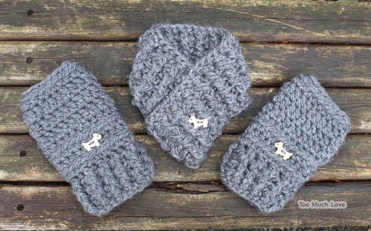 three crocheted hats sitting on top of a wooden table next to each other