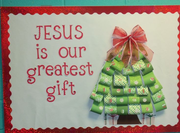 a christmas tree made out of green crackers with a red bow on it and the words jesus is our greatest gift