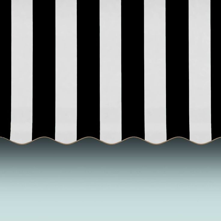 a black and white striped awning over water