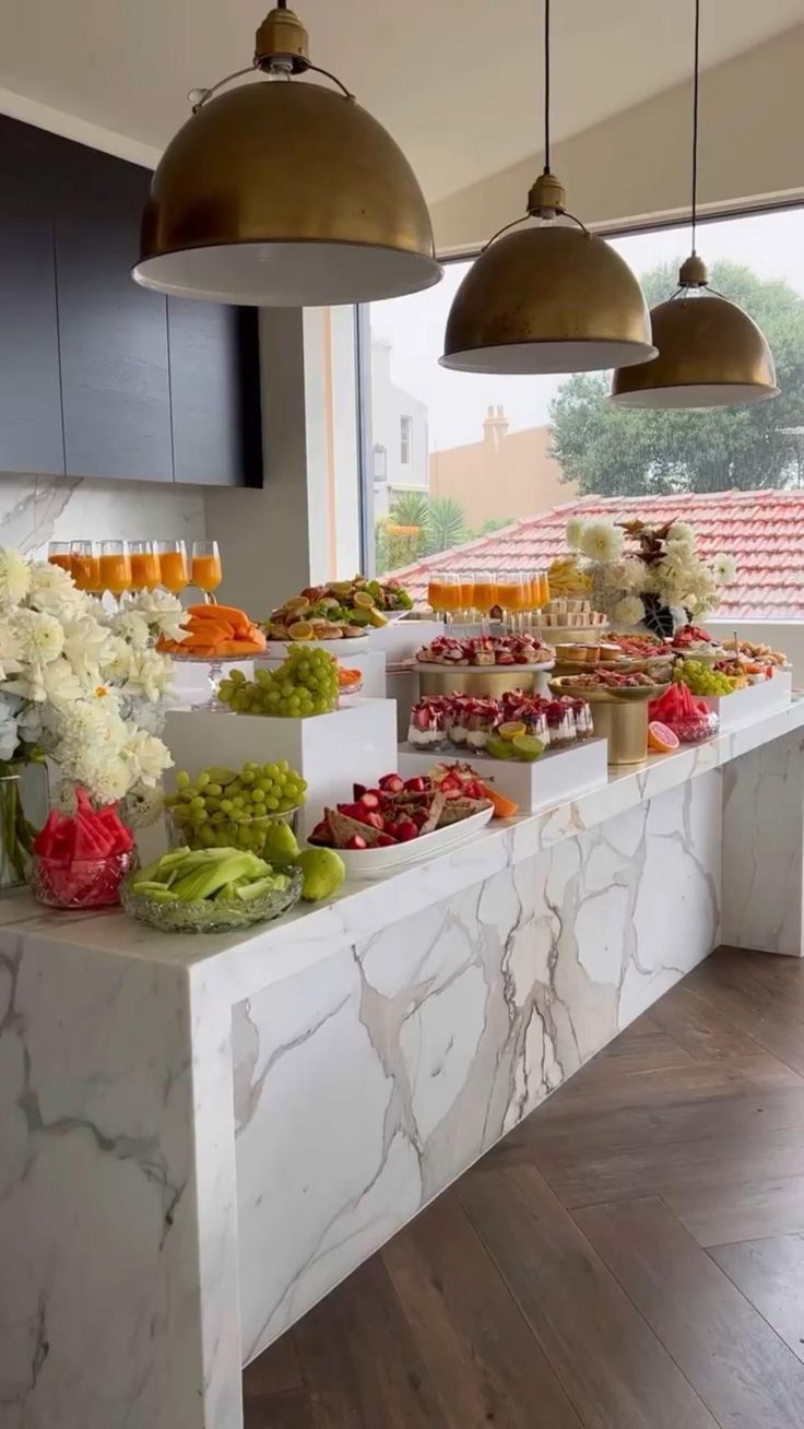 a marble counter topped with lots of food