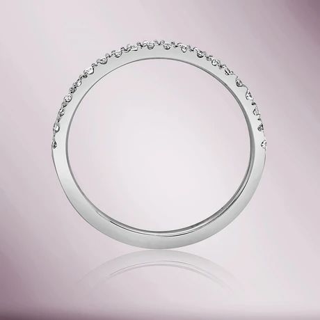 a white gold wedding ring with diamonds on the sides and an oval design in the middle