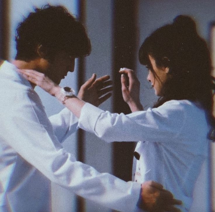 a man and woman dance together in the middle of an artistic photo with blurry background