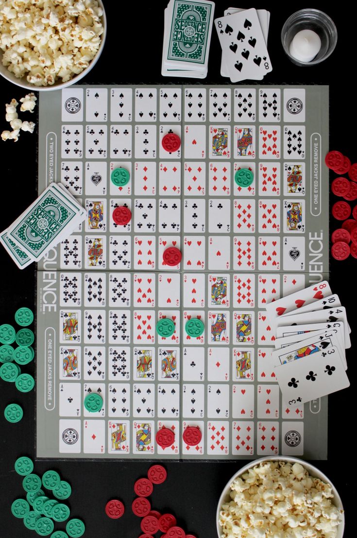 a board game with dices and bowls of popcorn