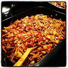 a large pan filled with cheetos and peanuts