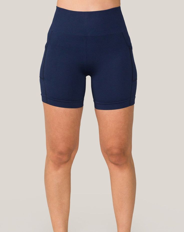 Offering a complete range of motion and reliable seamless support, these flattering navy seamless pocket shorts for women will inspire you to go far. This style of navy seamless pocket shorts runs small. Please consider sizing up. Seamless 4-way Stretch Shorts, Navy Activewear With Built-in Shorts For Gym, Sporty Stretch Navy Shorts, Navy Stretch Sporty Shorts, Navy Functional Shorts, Navy Activewear With Built-in Shorts For Training, Navy Stretch Athleisure Shorts, Navy Stretchable Training Shorts, Navy Stretch Training Shorts