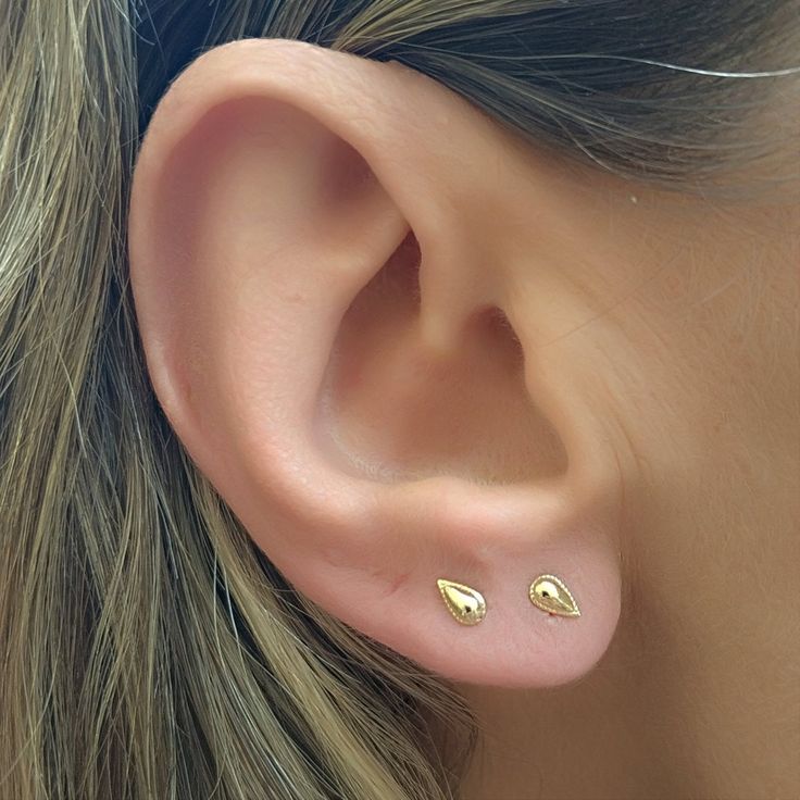 "Solid Gold 14K Teardrop Stud Earrings, Unique Small Post Stud Earrings, Classic Modern Jewelry, Everyday Minimalist Gold Studs oooo For those of you looking to add a classic touch of elegance to their style! These small gold stud earrings have a dainty teardrop design surrounded with tiny dots, placed gracefully along your lower or upper earlobe. Minimalist geometric jewelry to accompany your ear piercing or wear as a stand alone! This is an enchanting Indian inspired jewelry to accompany your Gold Teardrop Cartilage Earrings, Minimalist Teardrop Single Plug Earring, Gold Teardrop Cartilage Earrings With Ear Wire, Gold Teardrop Cartilage Single Earring, Gold Teardrop Single Cartilage Earring, Teardrop Cartilage Earrings, Dainty Teardrop Cartilage Earrings, Gold Teardrop Cartilage Earrings As Gift, Sterling Silver Teardrop Plug Earrings