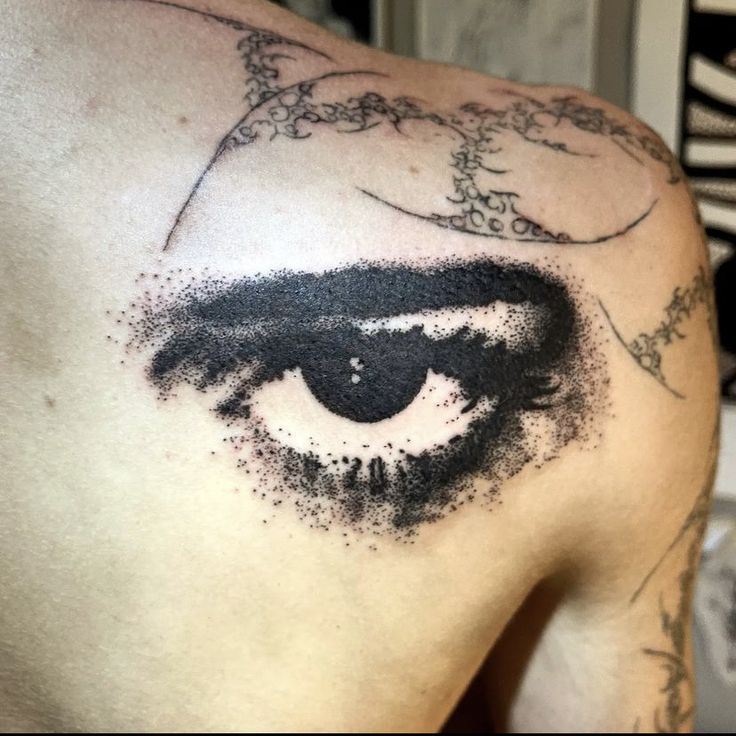 a close up of a person's eye with black ink