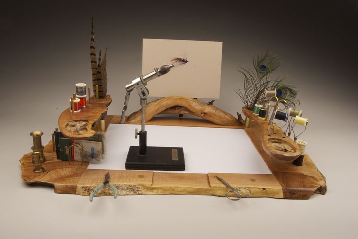 a wooden desk with various items on it