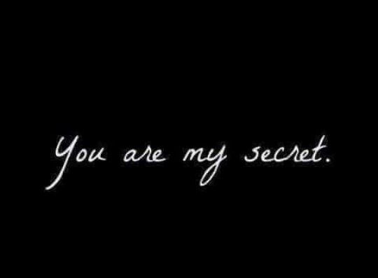 the words you are my secret written in white on a black background with an image of a