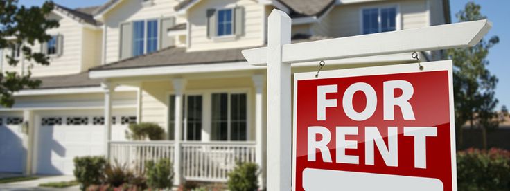 a for sale sign in front of a house