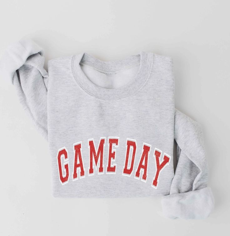 Game day graphic unisex fleece pullover relaxed fit. -Spun from plush sponge fleece fabric -Remarkably soft unisex pullover -Crewneck sweatshirt lends itself to daily wear and year-round layering. -Featuring ribbed cuffs and waistband, a crew neck, and fashion-forward fleece fabrication. Game Day Sweatshirt, Women's Sweatshirts, Blue Sweatshirt, Graphic Crewneck Sweatshirt, Fleece Fabric, Game Day, Trendy Outfits, Daily Wear, Fashion Forward