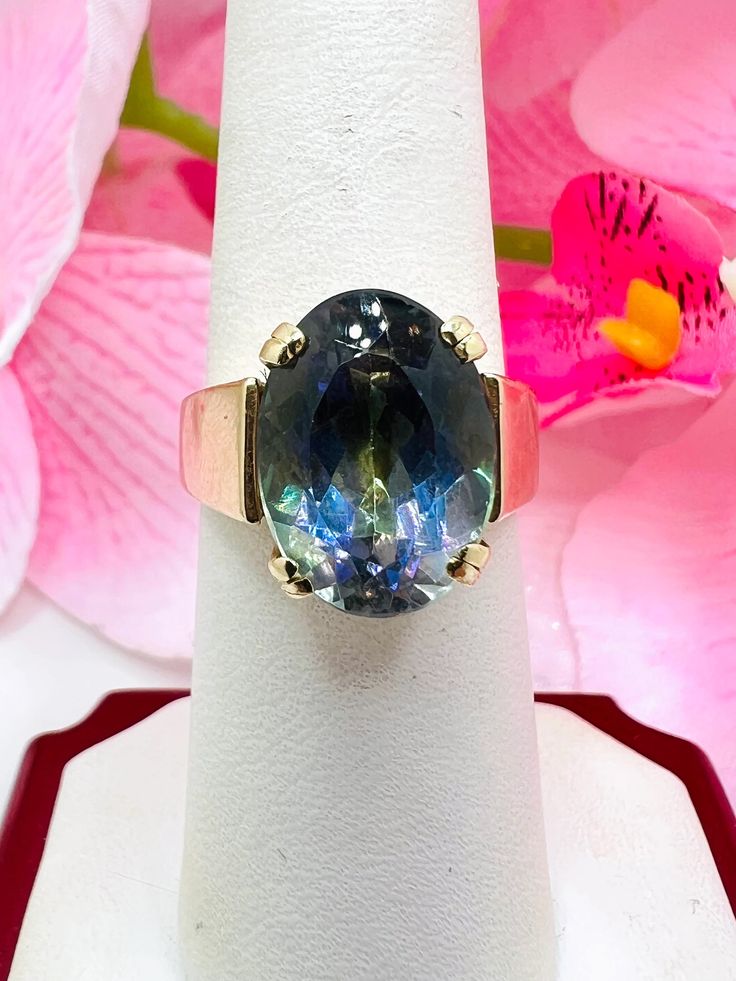 14K Yellow Gold Synthetic Alexandrite Cocktail Ring Size 7 A perfect gift for your loved one for any special occasion or holiday! Total Ring Weight: 11.50g Ring Length: 27.29mm Ring Width: 20.19mm Gemstone: Synthetic Alexandrite Item will be placed into a gift box. * High Luster Oval Ring In 14k Gold, High Luster 14k Gold Oval Rings, Formal Iridescent Oval Ring, 14k Gold High Luster Rings As A Gift, 14k Gold Rings With High Luster For Gift, Fine Jewelry Rings As Gift With High Luster, High Luster 14k Gold Rings For Gift, Elegant Iridescent Rings With Accent Stones, Formal Iridescent Rings With Accent Stones