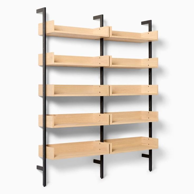 a wooden shelf with black metal brackets on it