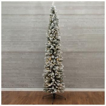 a white christmas tree on a stand in front of a wall with wood flooring