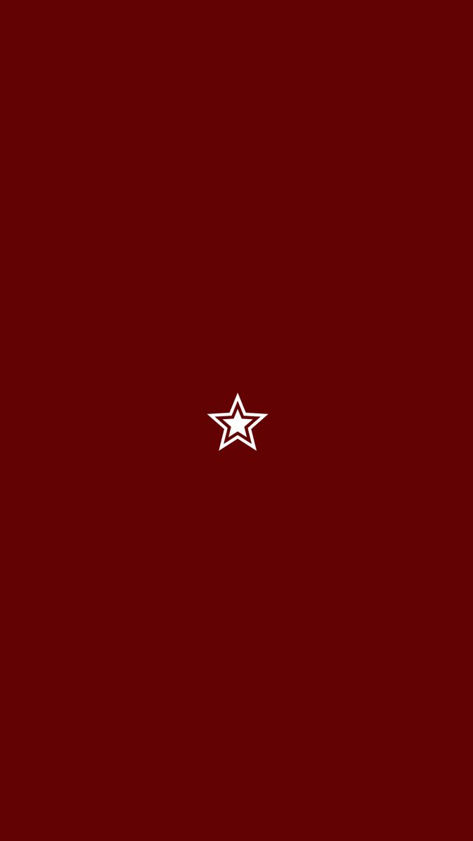 a red background with two white stars on the left and right side of the image