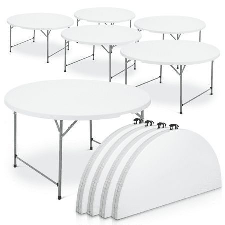 several tables with white tops are arranged in a row and one has four black legs