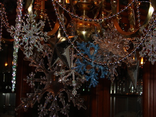 a chandelier with snowflakes hanging from it